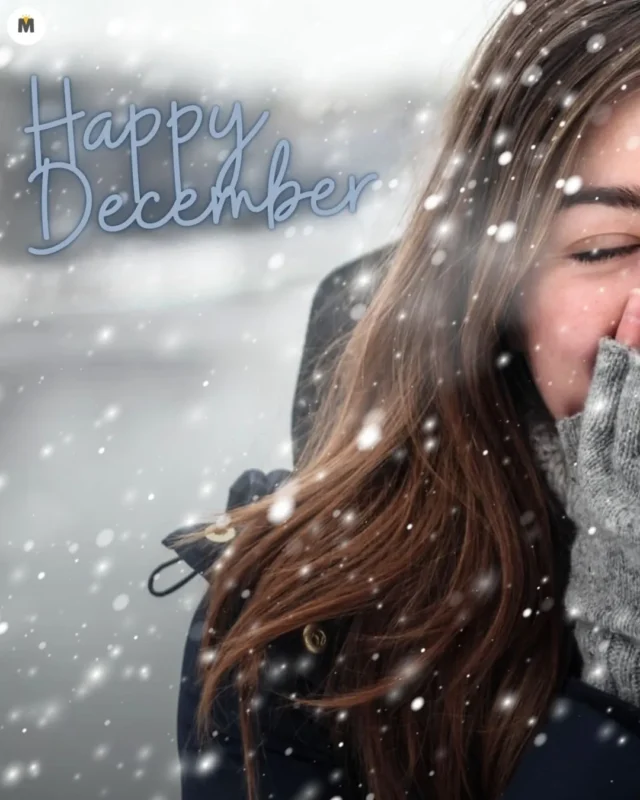 100+ Good Morning December Images ❄️ 57 A woman with long brown hair wearing a winter coat and gray gloves is smiling amid falling snow. The text Happy December is written in blue Good Morning December Images